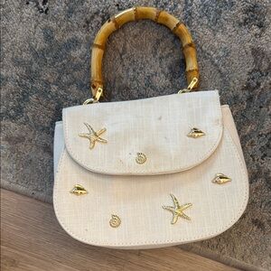 Elegant Cream Handbag with Bamboo Handle